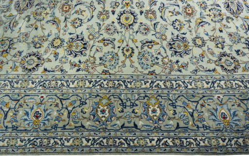 Corner detail of 1970s Kashan rug showing border pattern and Wool pile