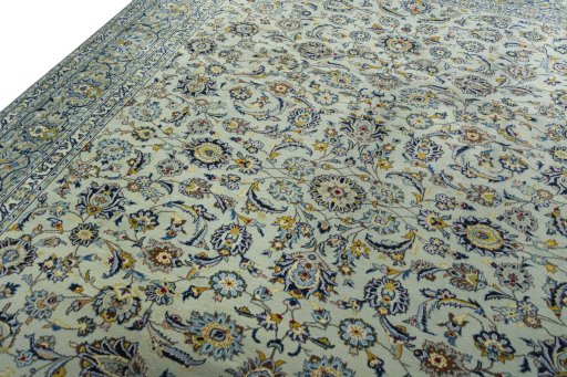 Backside of handmade 1970s Kashan rug showing knot structure and weave density