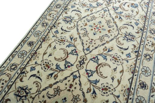 Backside of handmade 2000s Kashan rug showing knot structure and weave density