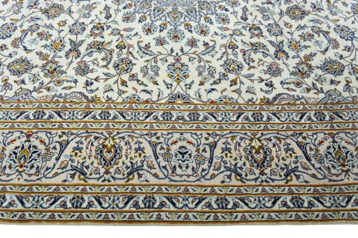 Corner detail of 2000s Kashan rug showing border pattern and Wool pile
