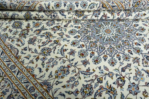 Close-up detail of 2000s Kashan rug from Iran / Persia showing Wool weave