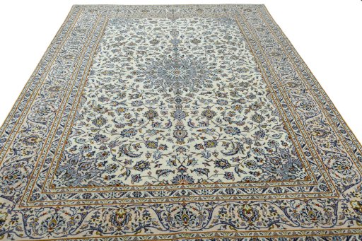 Surface texture of 2000s Kashan rug with natural Wool and intricate pattern