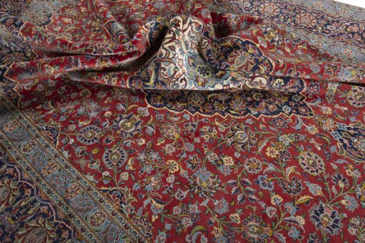 Surface texture of 2000s Kashan rug with natural Cork and intricate pattern