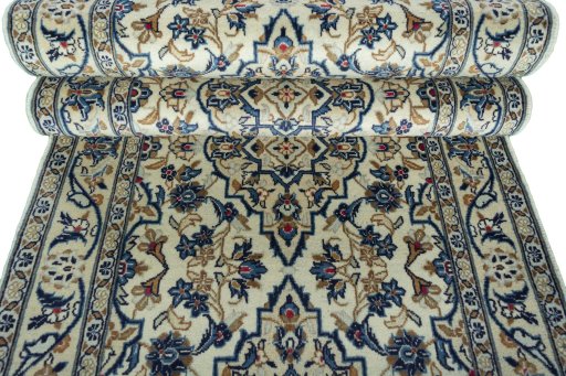 Corner detail of 2000s Kashan rug showing border pattern and Wool pile