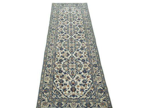 Surface texture of 2000s Kashan rug with natural Wool and intricate pattern