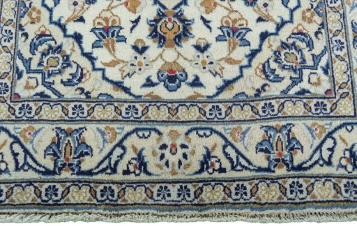 Close-up detail of 2000s Kashan rug from Iran / Persia showing Wool weave