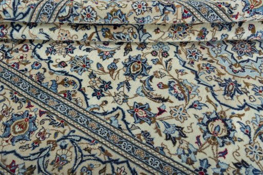 Close-up detail of 2000s Kashan rug from Iran / Persia showing Wool weave