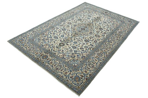 Corner detail of 2000s Kashan rug showing border pattern and Wool pile