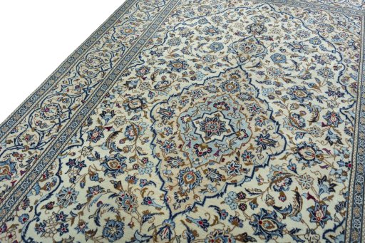Backside of handmade 2000s Kashan rug showing knot structure and weave density