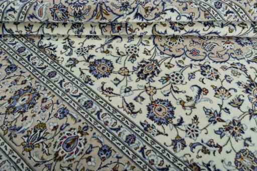 Close-up detail of 2000s Kashan rug from Iran / Persia showing Wool weave