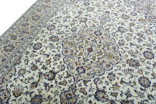 Backside of handmade 2000s Kashan rug showing knot structure and weave density