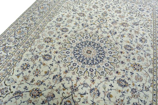 Backside of handmade 2000s Kashan rug showing knot structure and weave density