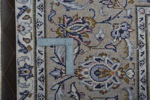 Backside of handmade 2000s Kashan rug showing knot structure and weave density