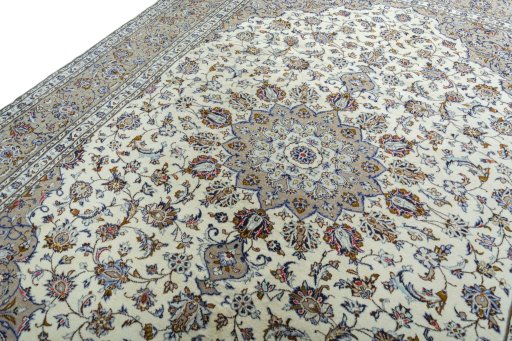 Backside of handmade 2000s Kashan rug showing knot structure and weave density