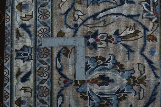 Backside of handmade 2000s Kashan rug showing knot structure and weave density