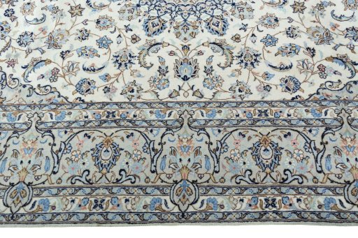 Corner detail of New Kashan rug showing border pattern and Wool pile