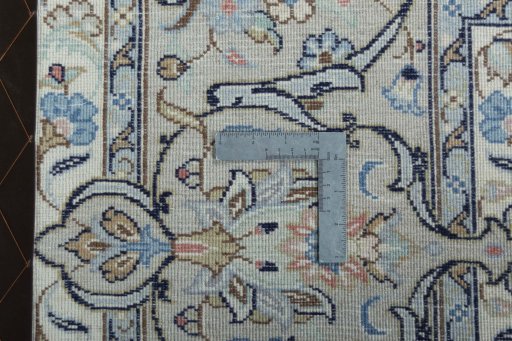 Backside of handmade New Kashan rug showing knot structure and weave density