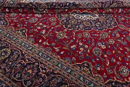 Close-up detail of 2000s Kashan rug from Iran / Persia showing Wool weave