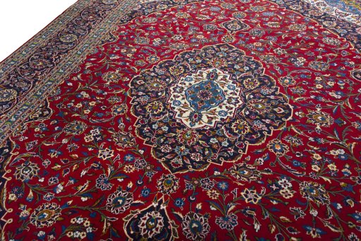 Backside of handmade 2000s Kashan rug showing knot structure and weave density