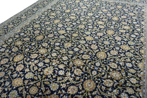 Backside of handmade 2000s Kashan rug showing knot structure and weave density