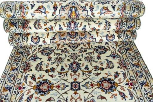 Corner detail of 2000s Kashan rug showing border pattern and Wool pile