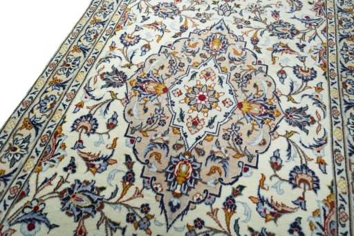 Backside of handmade 2000s Kashan rug showing knot structure and weave density