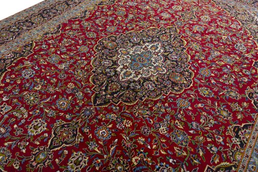 Backside of handmade 2000s Kashan rug showing knot structure and weave density