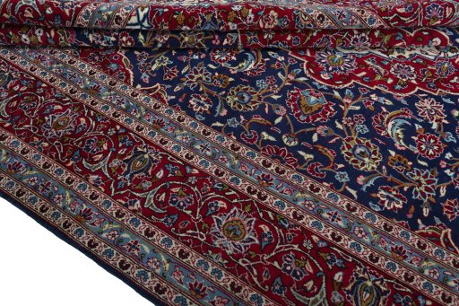 Close-up detail of 2000s Kashan rug from Iran / Persia showing Wool weave