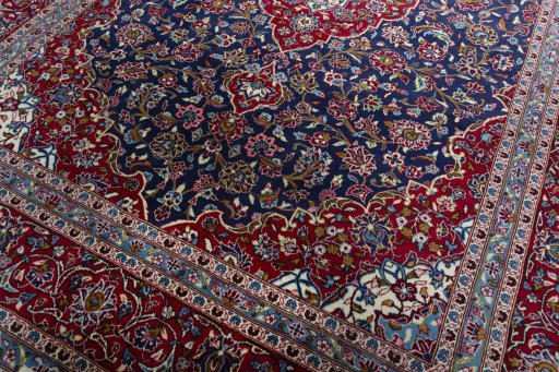 Close-up detail of 2000s Kashan rug from Iran / Persia showing Wool weave