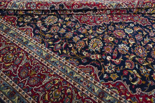 Close-up detail of 2000s Kashan rug from Iran / Persia showing Wool weave