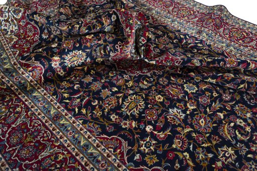 Surface texture of 2000s Kashan rug with natural Wool and intricate pattern