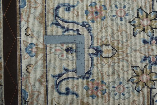 Backside of handmade 2000s Kashan rug showing knot structure and weave density
