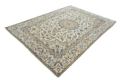 Corner detail of 2000s Kashan rug showing border pattern and Wool pile