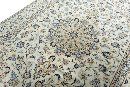Backside of handmade 2000s Kashan rug showing knot structure and weave density