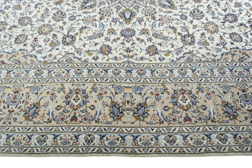 Corner detail of 2000s Kashan rug showing border pattern and Wool pile