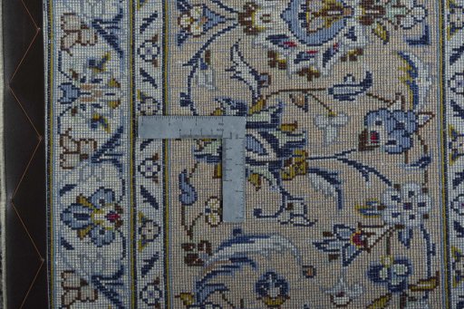 Backside of handmade 2000s Kashan rug showing knot structure and weave density
