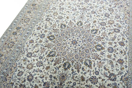 Backside of handmade 2000s Kashan rug showing knot structure and weave density