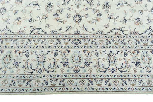 Corner detail of New Kashan rug showing border pattern and Wool pile