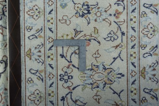 Backside of handmade New Kashan rug showing knot structure and weave density