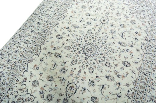 Backside of handmade New Kashan rug showing knot structure and weave density