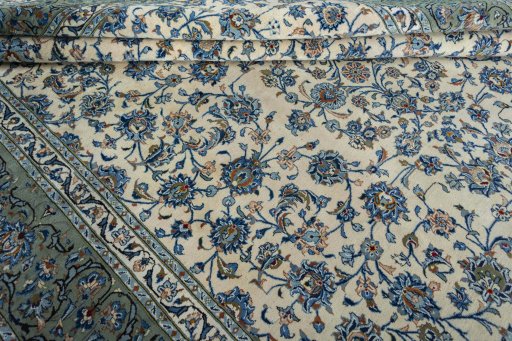 Close-up detail of 2000s Kashan rug from Iran / Persia showing Wool weave