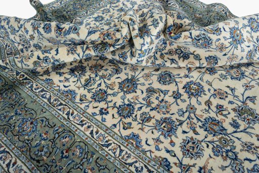 Surface texture of 2000s Kashan rug with natural Wool and intricate pattern