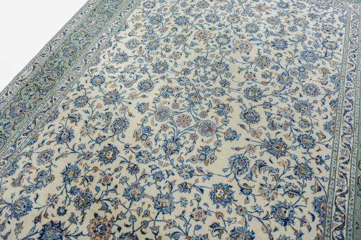Backside of handmade 2000s Kashan rug showing knot structure and weave density