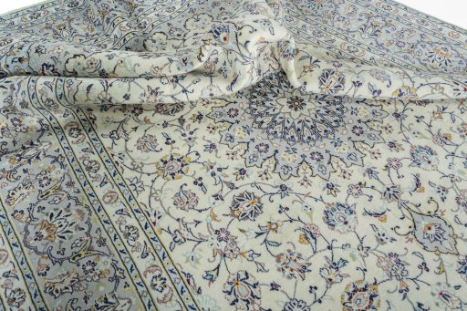 Surface texture of 2000s Kashan rug with natural Wool and intricate pattern