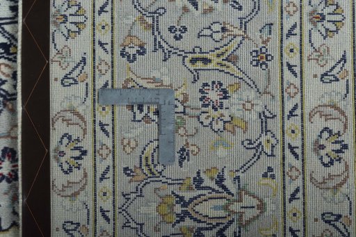 Backside of handmade 2000s Kashan rug showing knot structure and weave density
