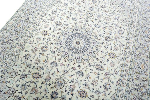 Backside of handmade 2000s Kashan rug showing knot structure and weave density