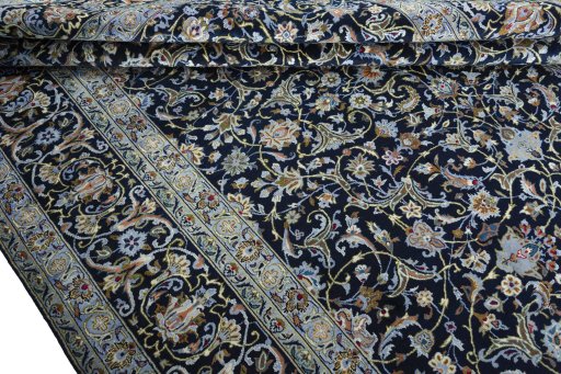 Close-up detail of 2000s Kashan rug from Iran / Persia showing Wool weave