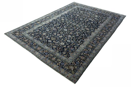 Corner detail of 2000s Kashan rug showing border pattern and Wool pile