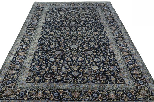 Surface texture of 2000s Kashan rug with natural Wool and intricate pattern