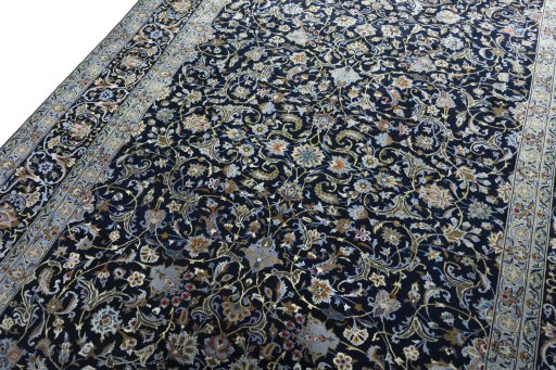 Backside of handmade 2000s Kashan rug showing knot structure and weave density